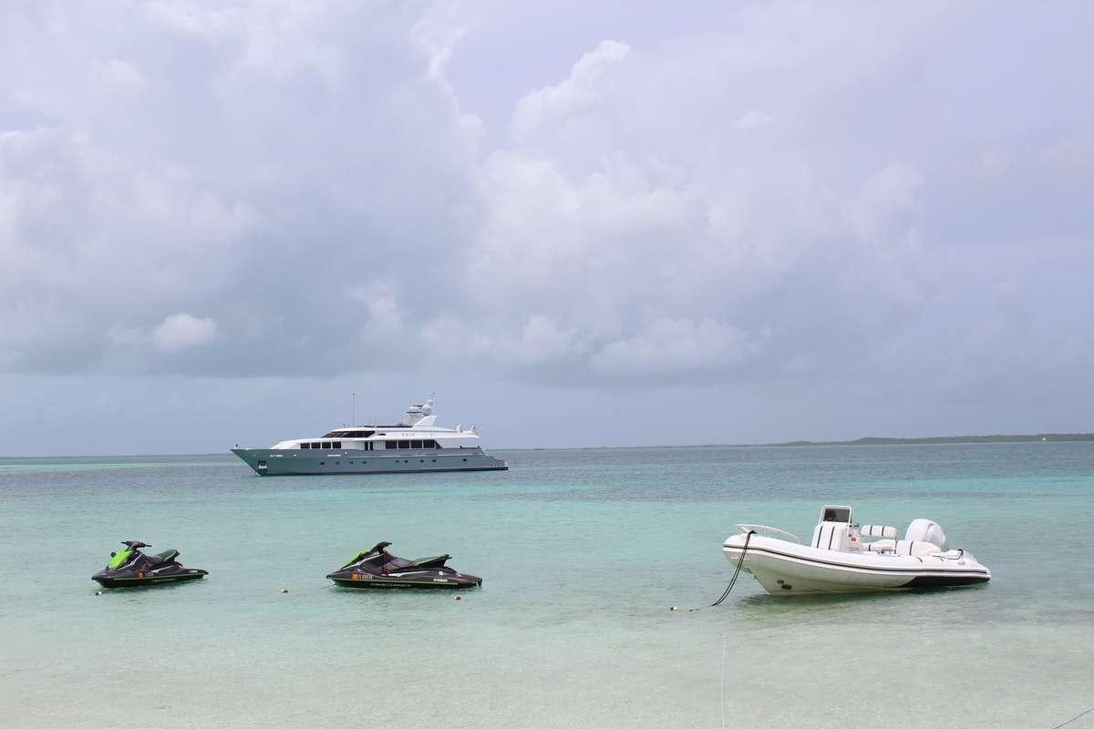 a group of boats in the ocean aboard ODIN Yacht for Charter