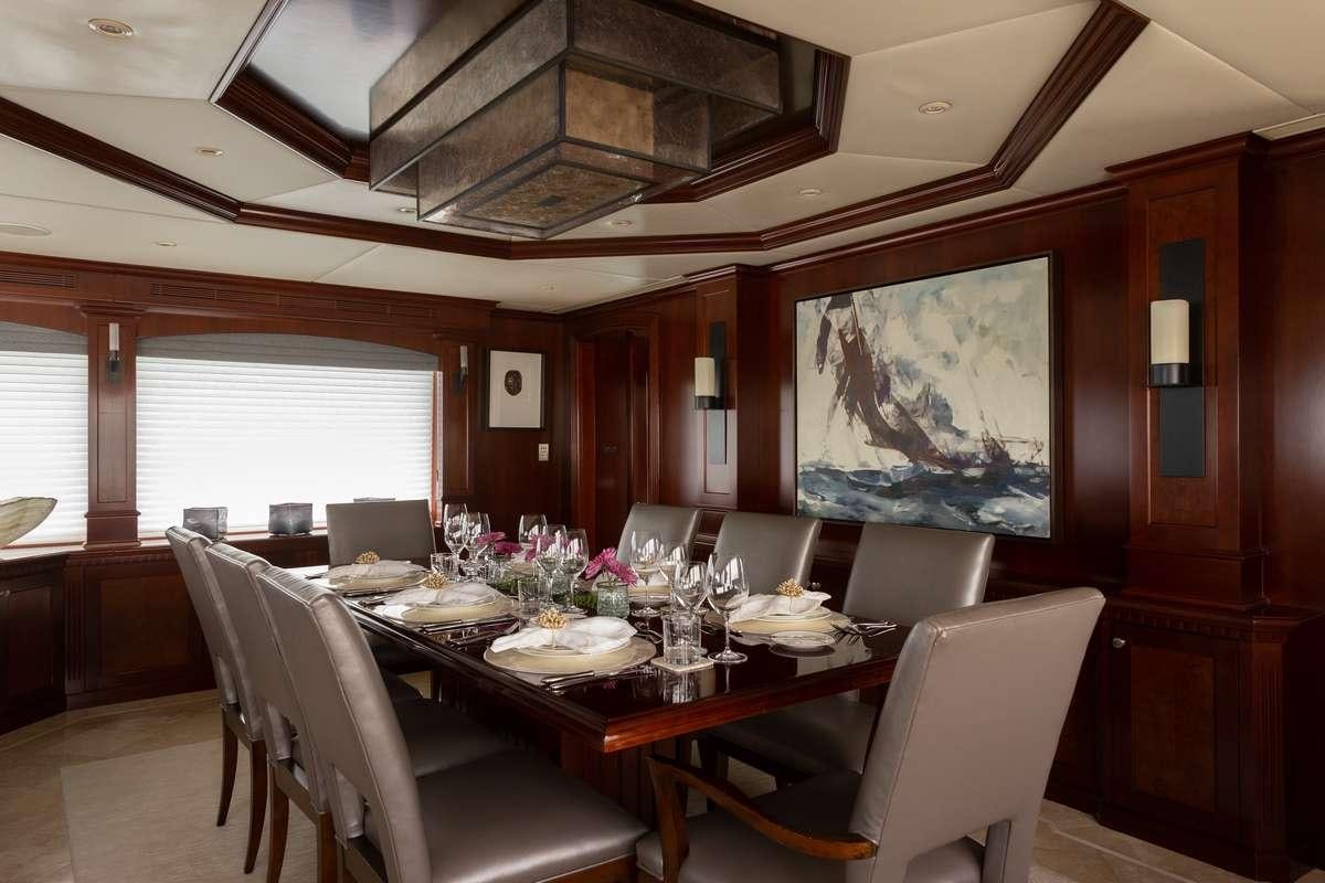 a dining room with a table and chairs aboard ODIN Yacht for Charter