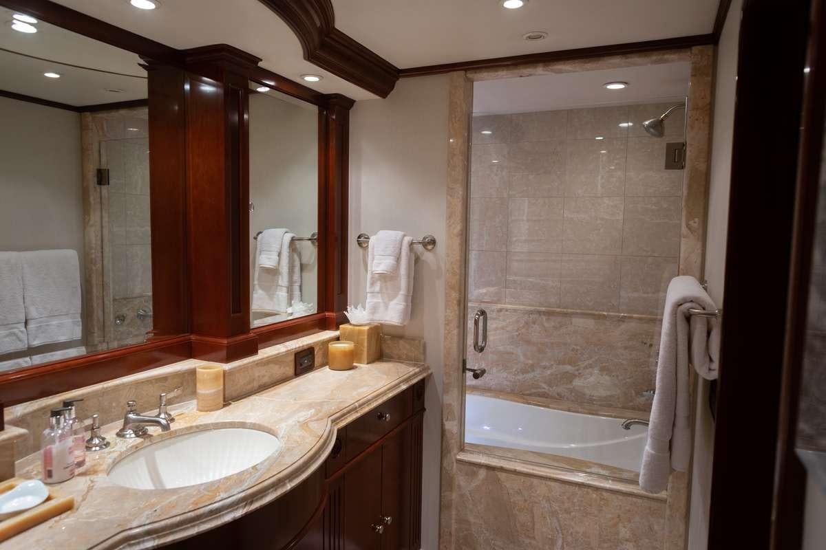 a bathroom with a large mirror aboard ODIN Yacht for Charter