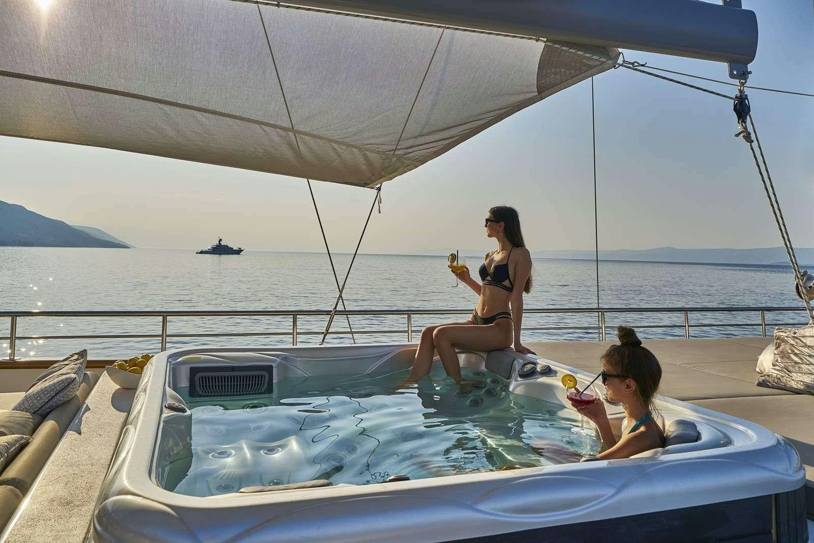 a person sitting on a boat aboard DALMATINO Yacht for Charter