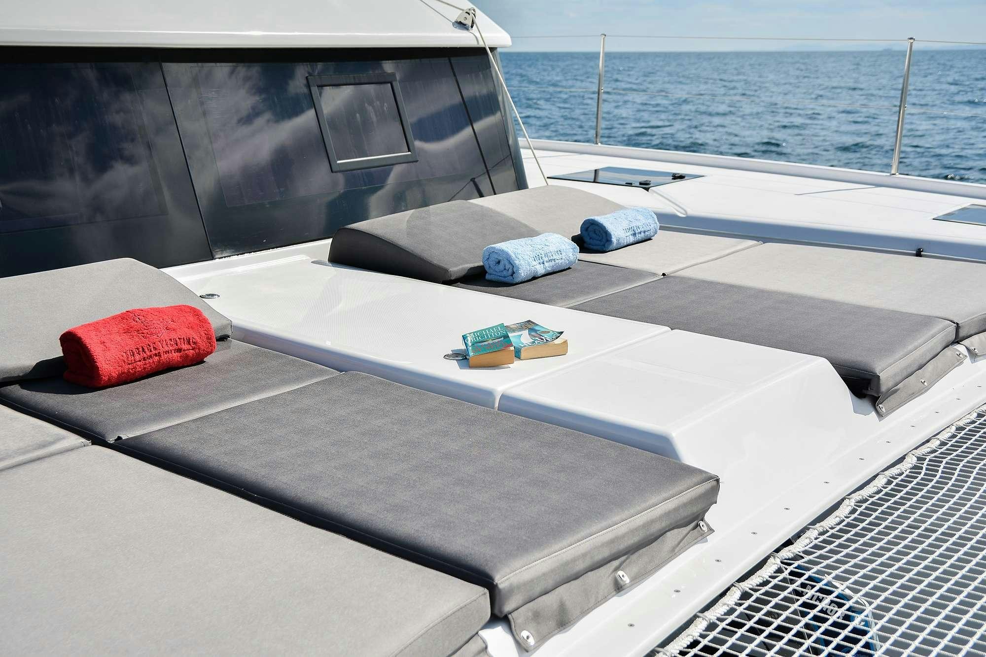 a deck with a boat on it aboard NeuroSeas Yacht for Charter