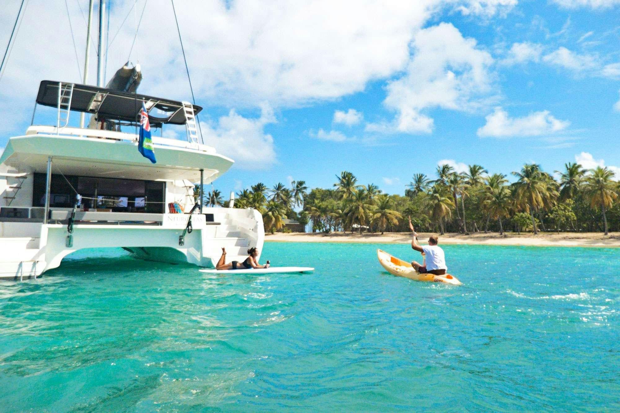 a boat with a person on it aboard NeuroSeas Yacht for Charter