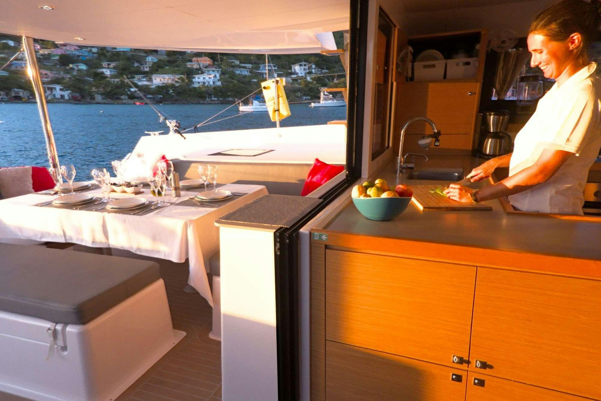 a person sitting at a table aboard NeuroSeas Yacht for Charter