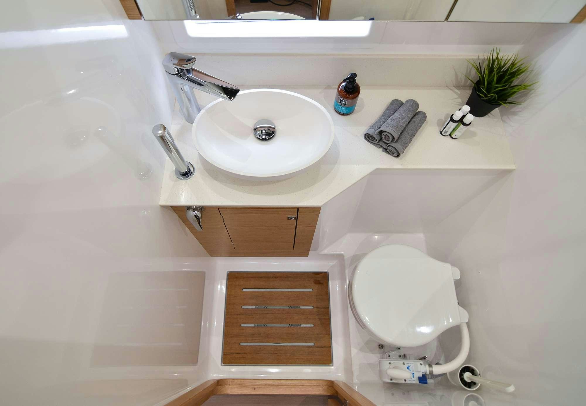 a bathroom with a sink and toilet aboard NeuroSeas Yacht for Charter