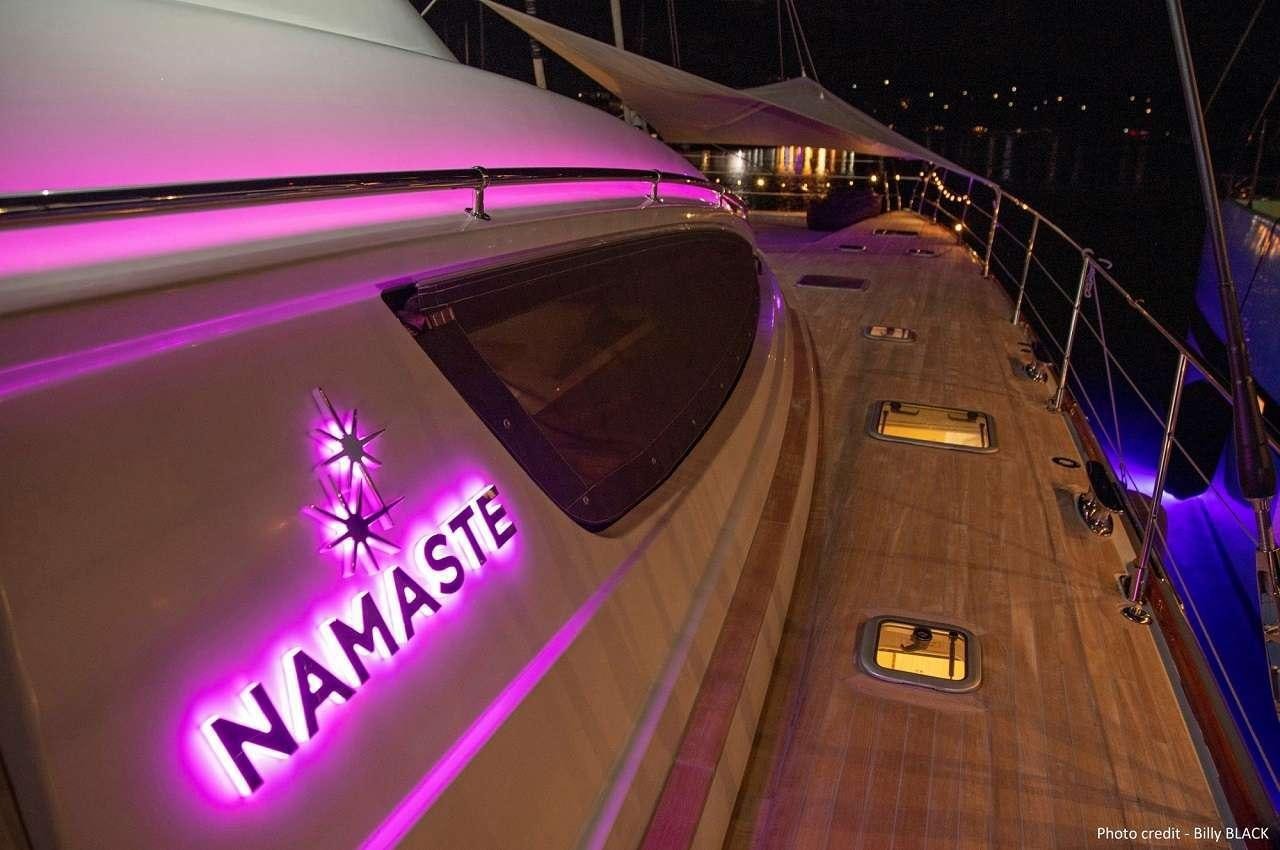 a large purple and white sports car aboard NAMASTE Yacht for Charter