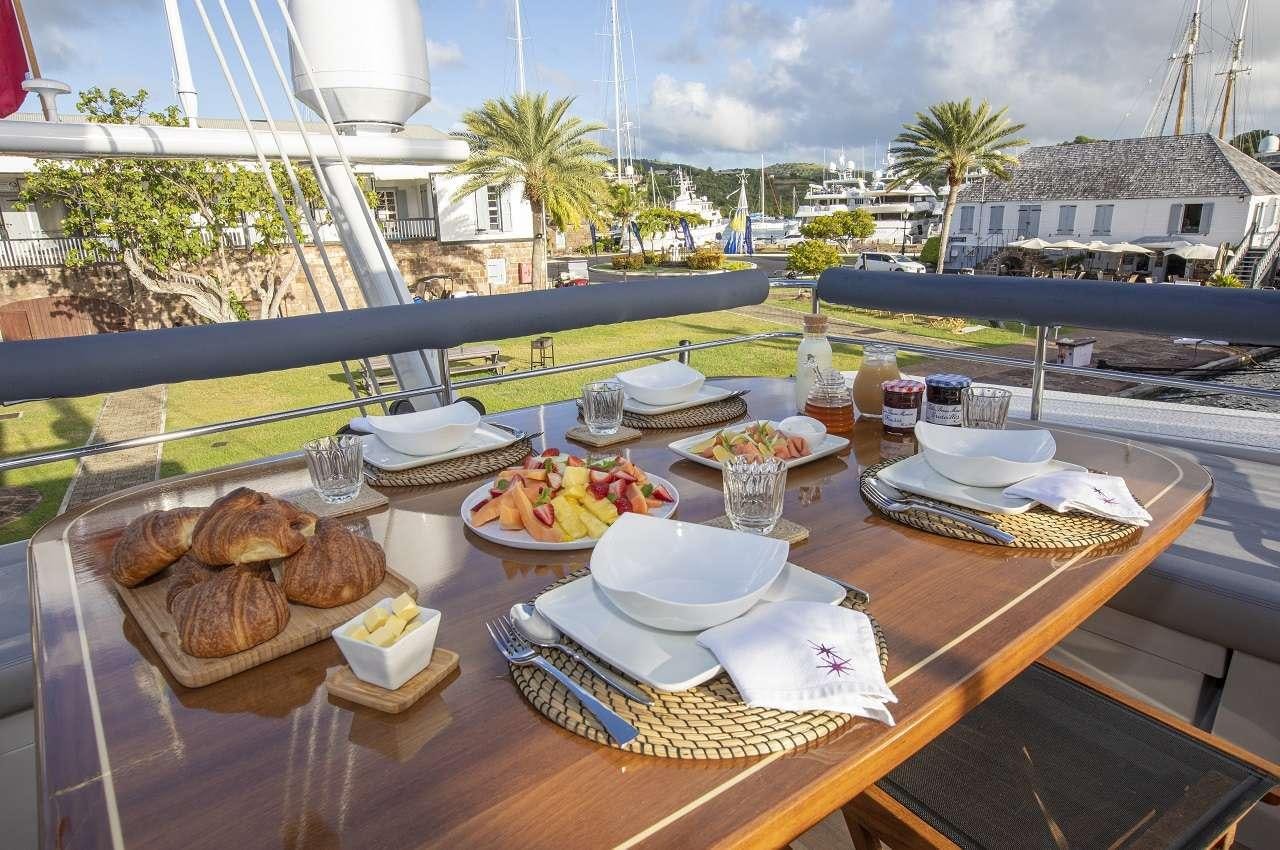 a table with food on it aboard NAMASTE Yacht for Charter