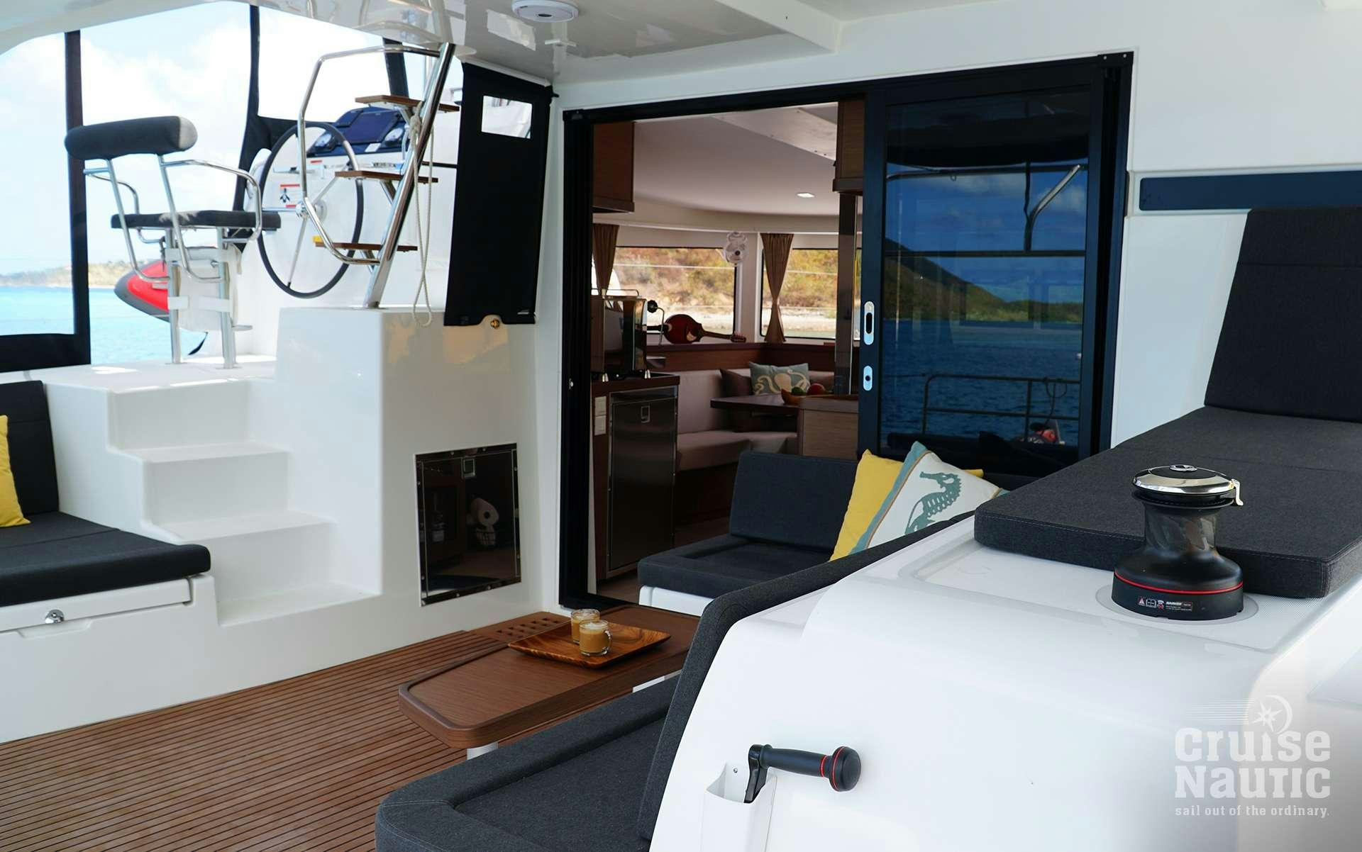 a room with a table and chairs aboard CruiseNautic Yacht for Charter