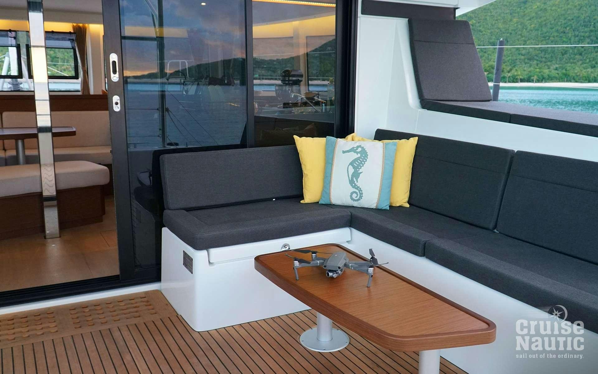 a room with a couch and a table aboard CruiseNautic Yacht for Charter