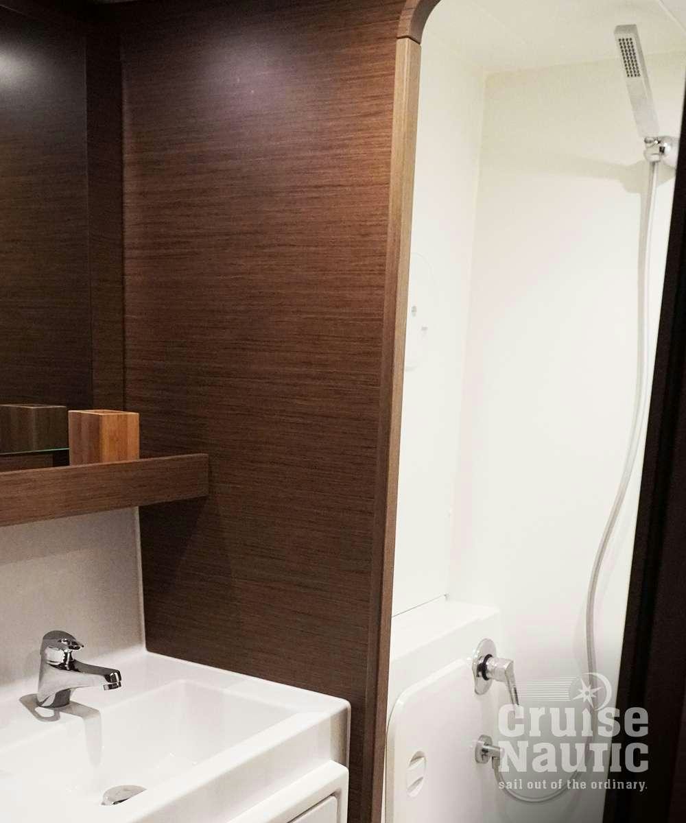 a bathroom with a shower and sink aboard CruiseNautic Yacht for Charter
