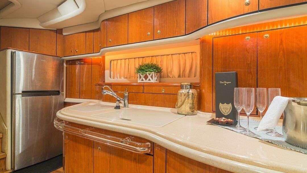 a kitchen with a large island aboard WHY NOT Yacht for Charter