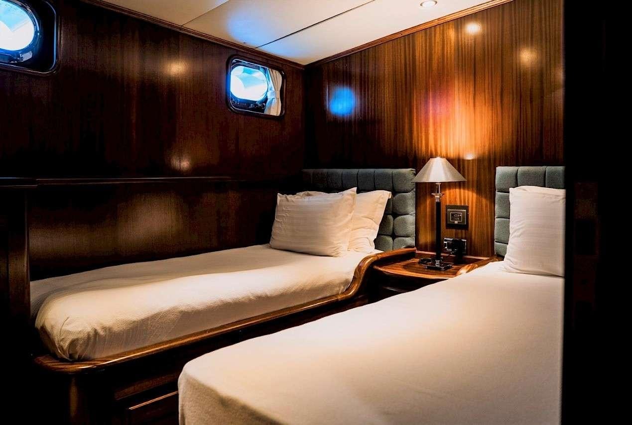 a couple of beds in a room aboard CAPRICORN 1 Yacht for Charter