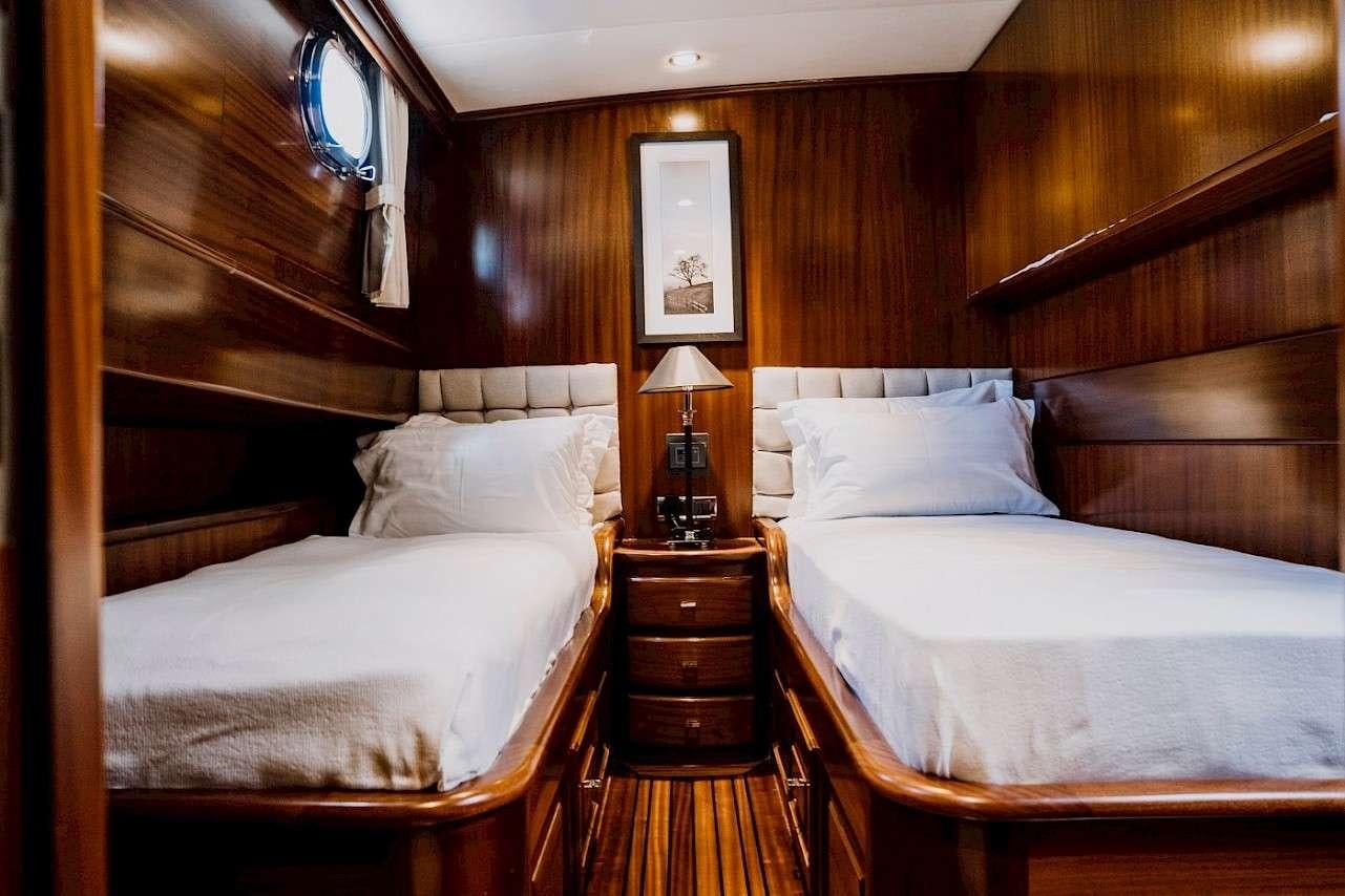 a couple of beds in a room aboard CAPRICORN 1 Yacht for Charter