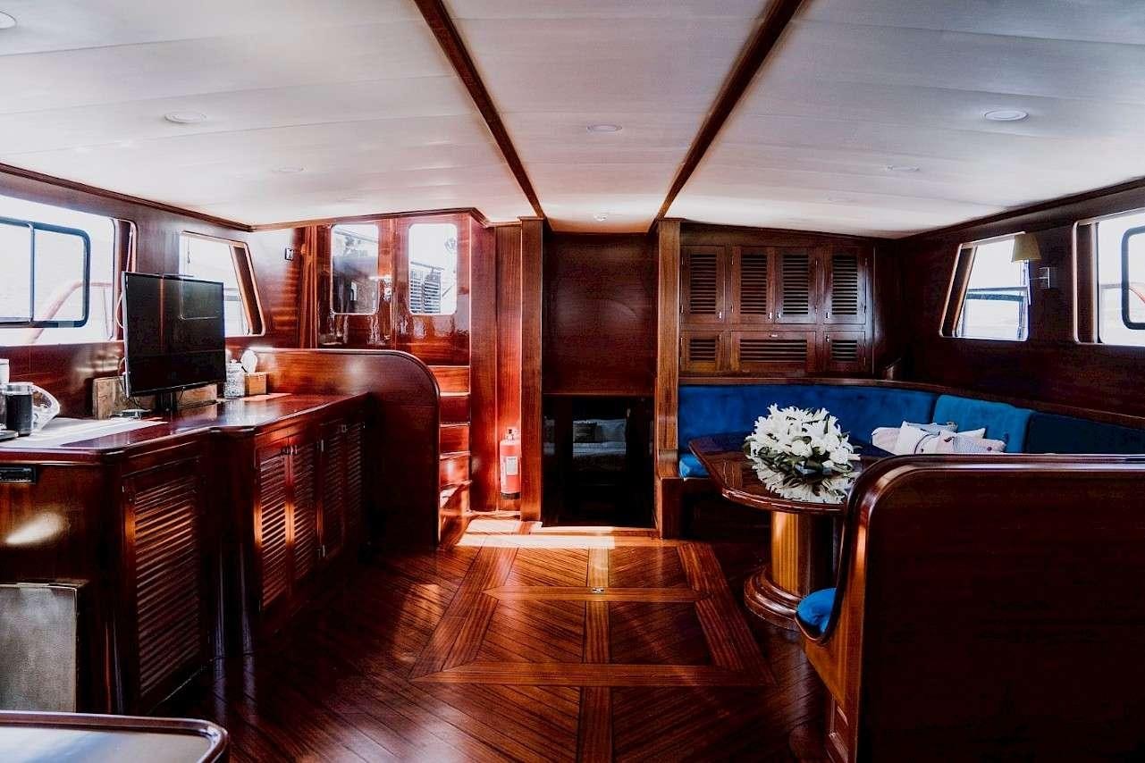 a room with a wood floor and a wood floor aboard CAPRICORN 1 Yacht for Charter