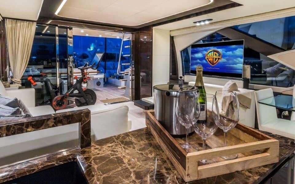 a bar with a large television screen aboard CARPE DIEM Yacht for Charter