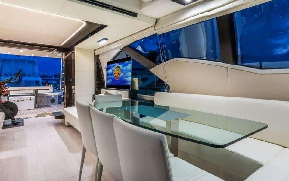 a room with a table and chairs aboard CARPE DIEM Yacht for Charter