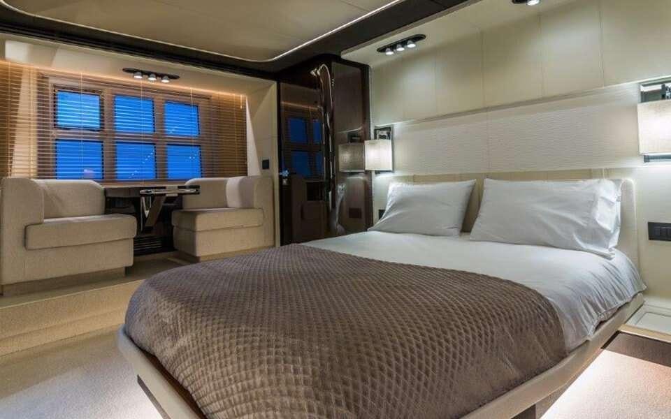 a large bed in a room aboard CARPE DIEM Yacht for Charter