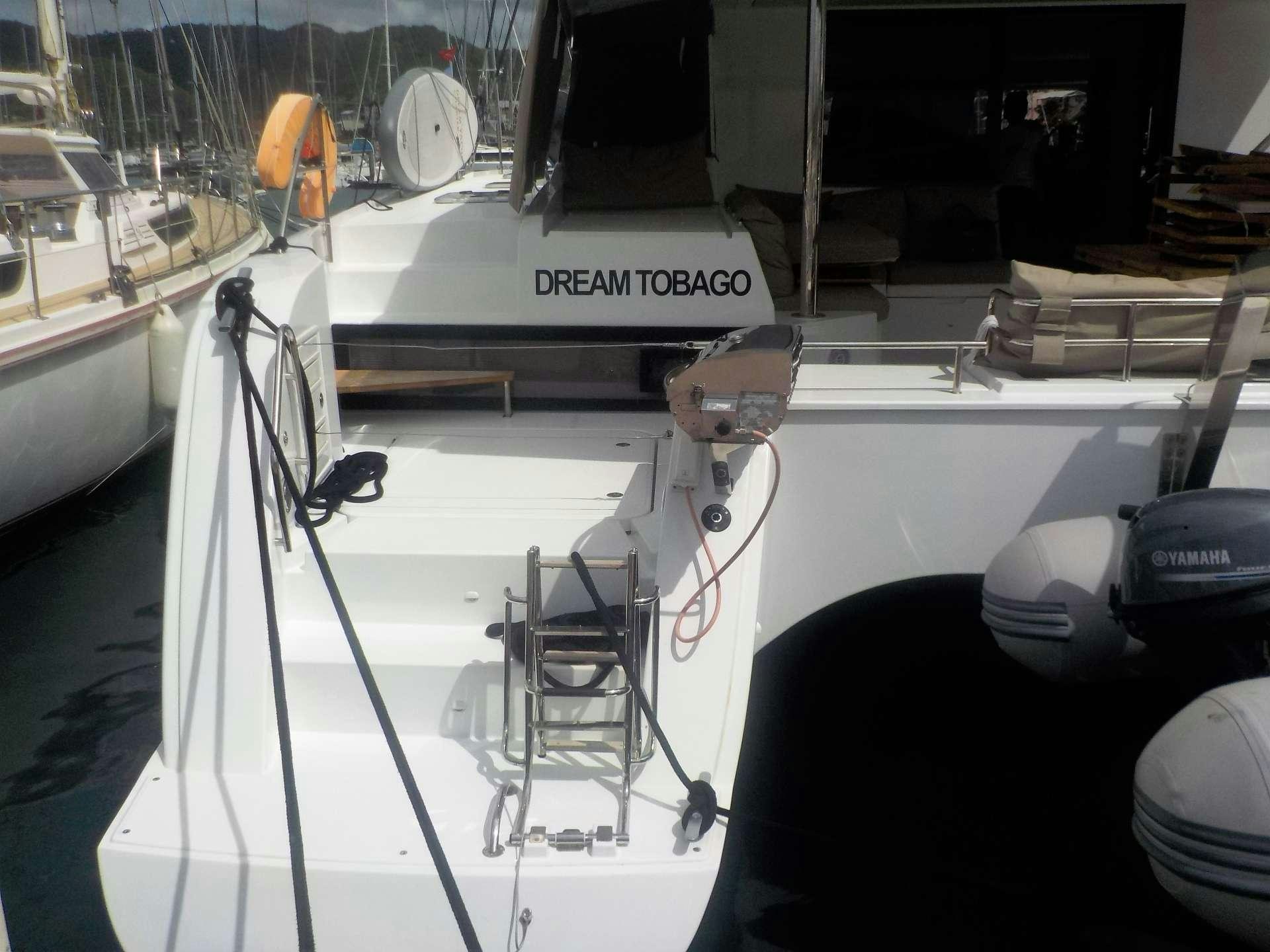 a boat with a steering wheel aboard DREAM TOBAGO Yacht for Charter