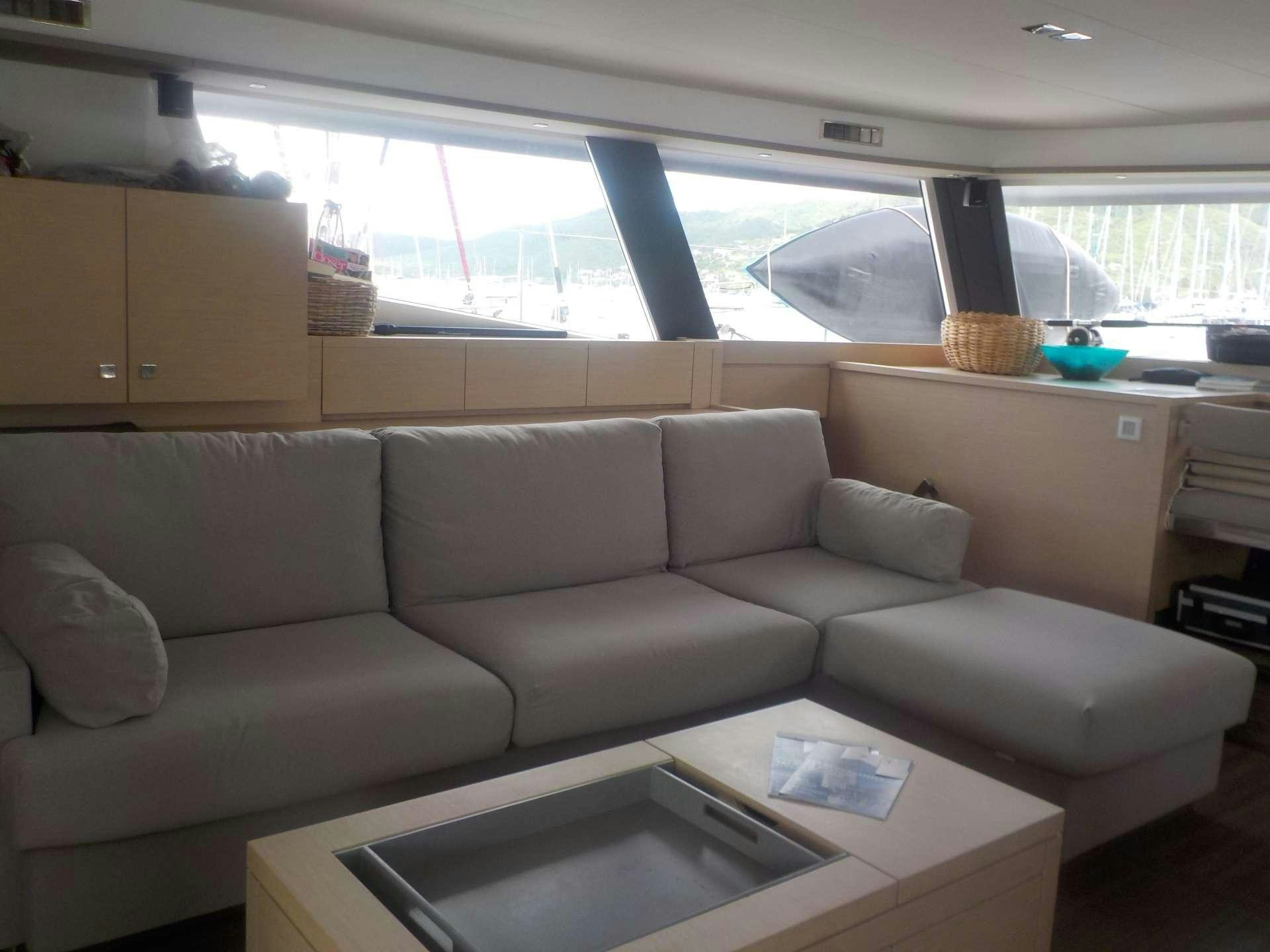 a living room with a couch aboard DREAM TOBAGO Yacht for Charter