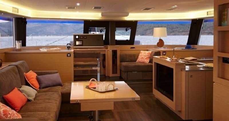 a living room with a couch and a tv aboard DREAM TOBAGO Yacht for Charter
