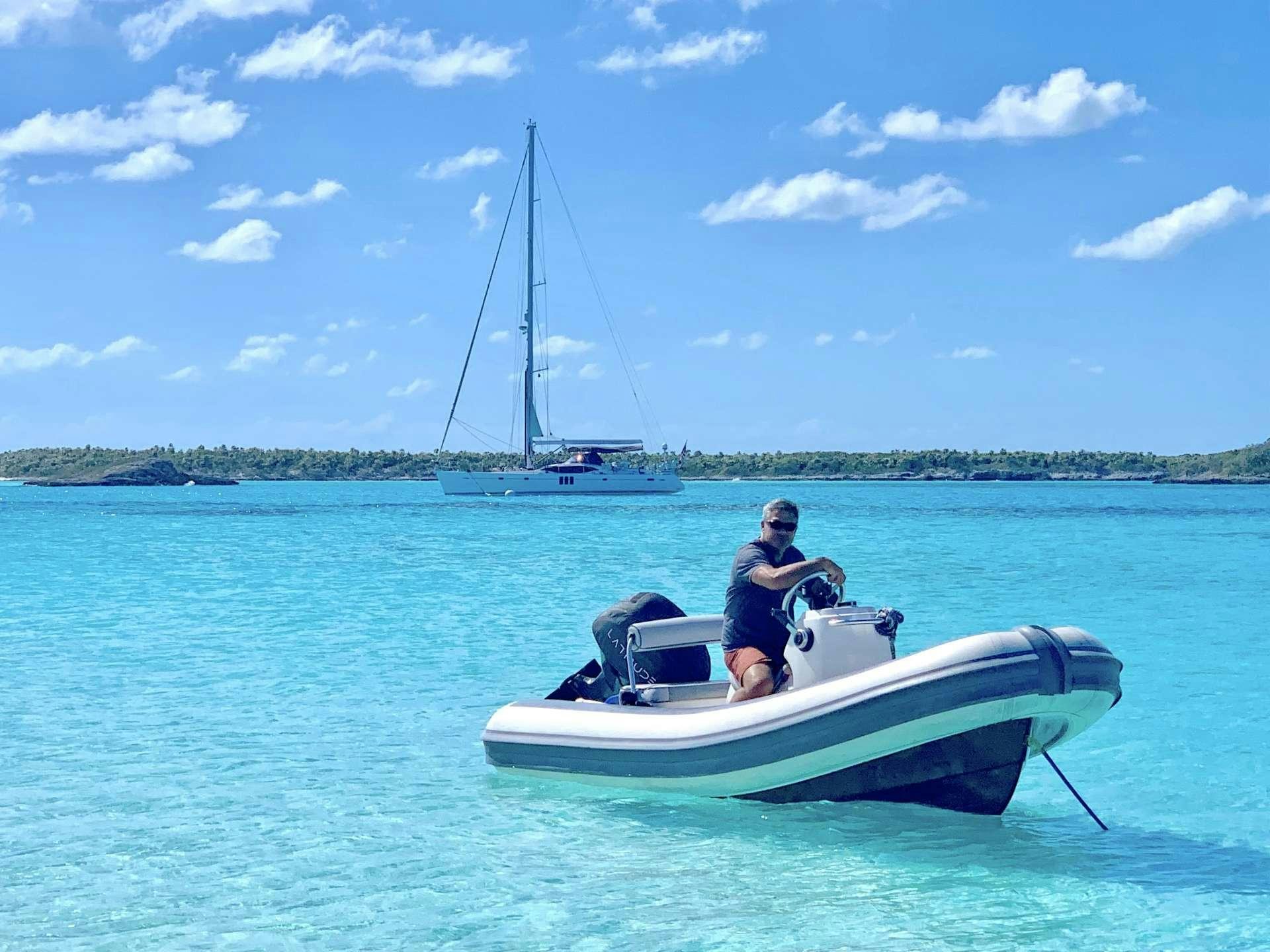 a man on a boat aboard LATITUDE Yacht for Charter