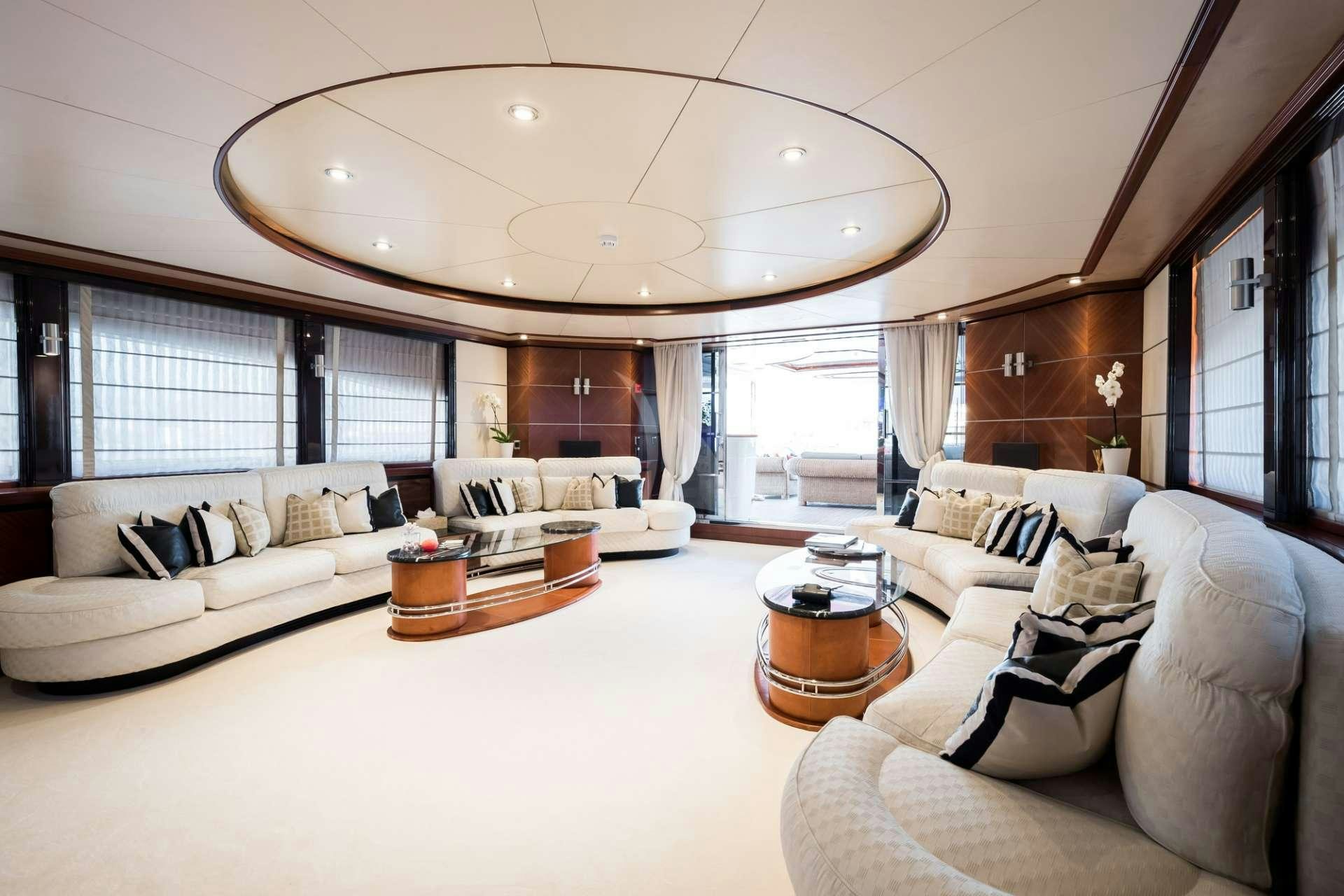 a living room with a large window aboard MAGENTA M Yacht for Charter
