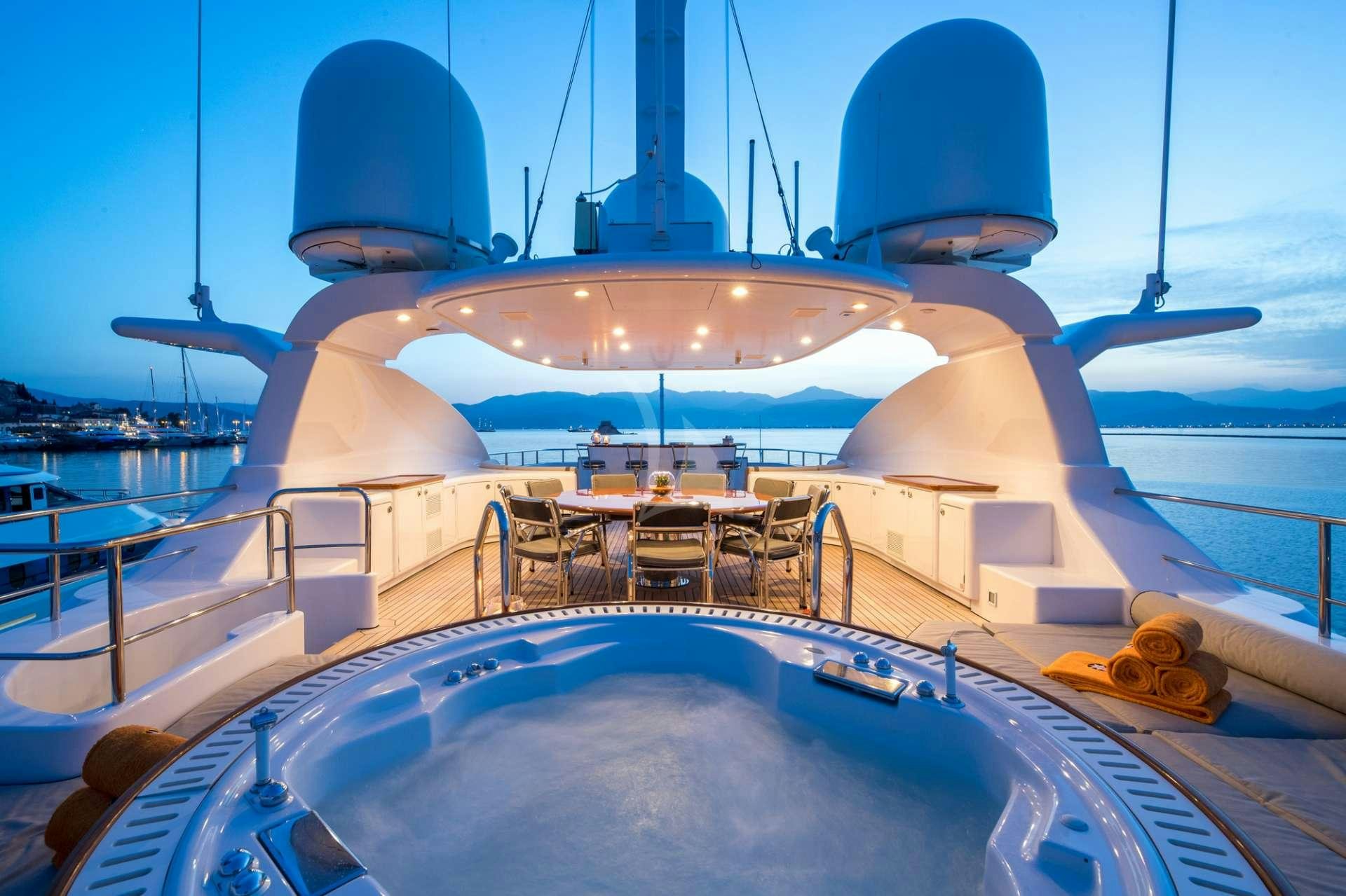 a large yacht with a large white tent on the deck aboard MAGENTA M Yacht for Charter
