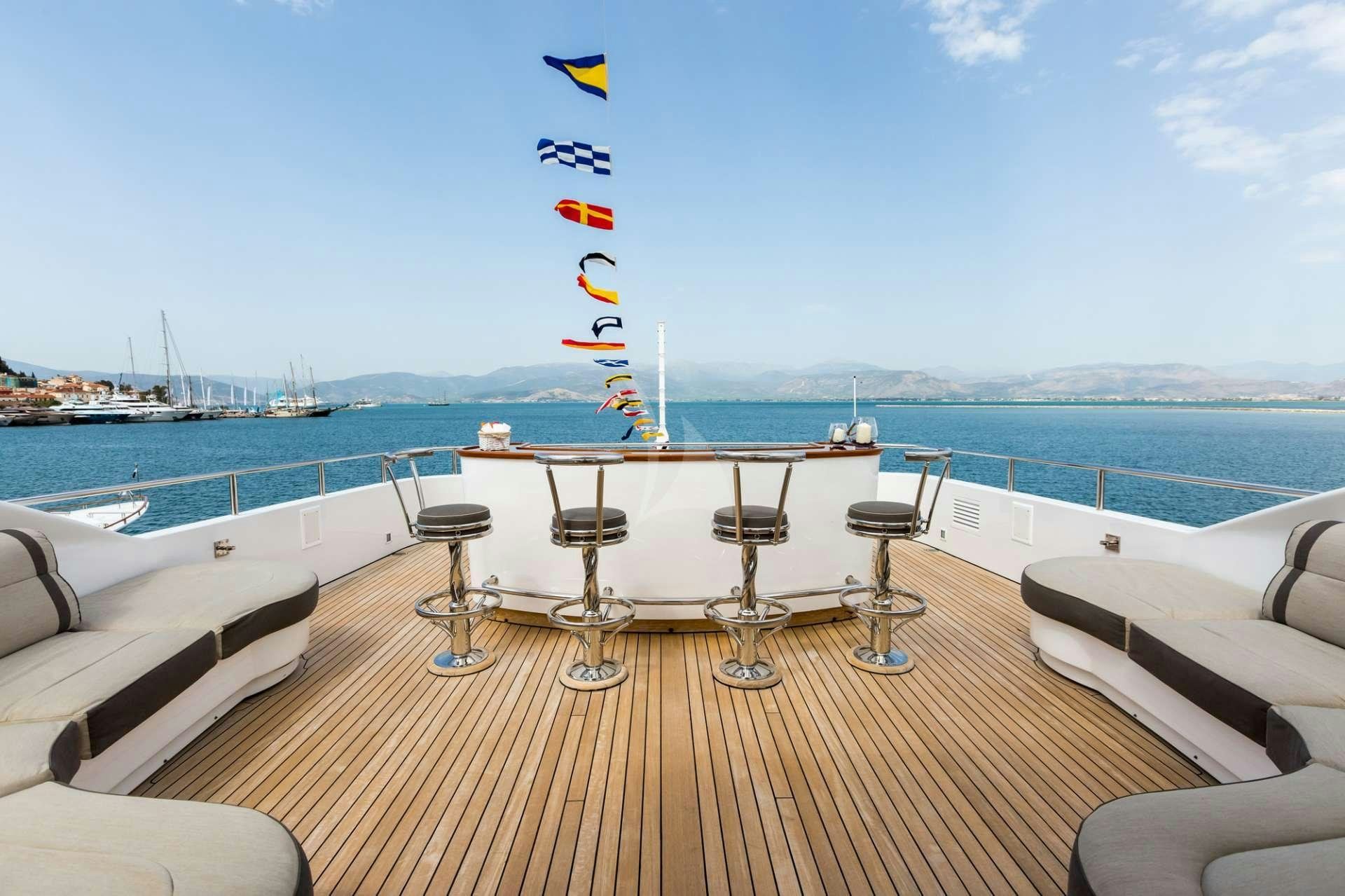 a large kite flying over a boat aboard MAGENTA M Yacht for Charter