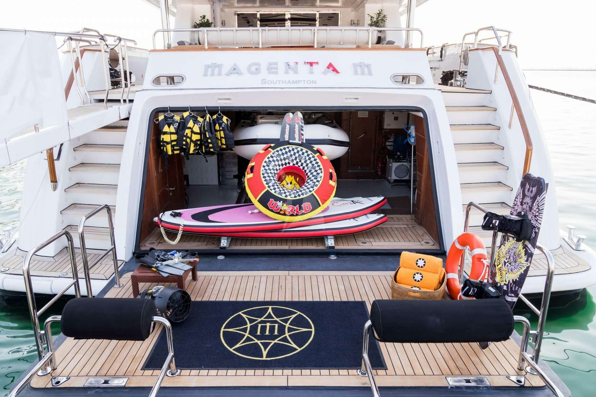 a boat with a steering wheel aboard MAGENTA M Yacht for Charter