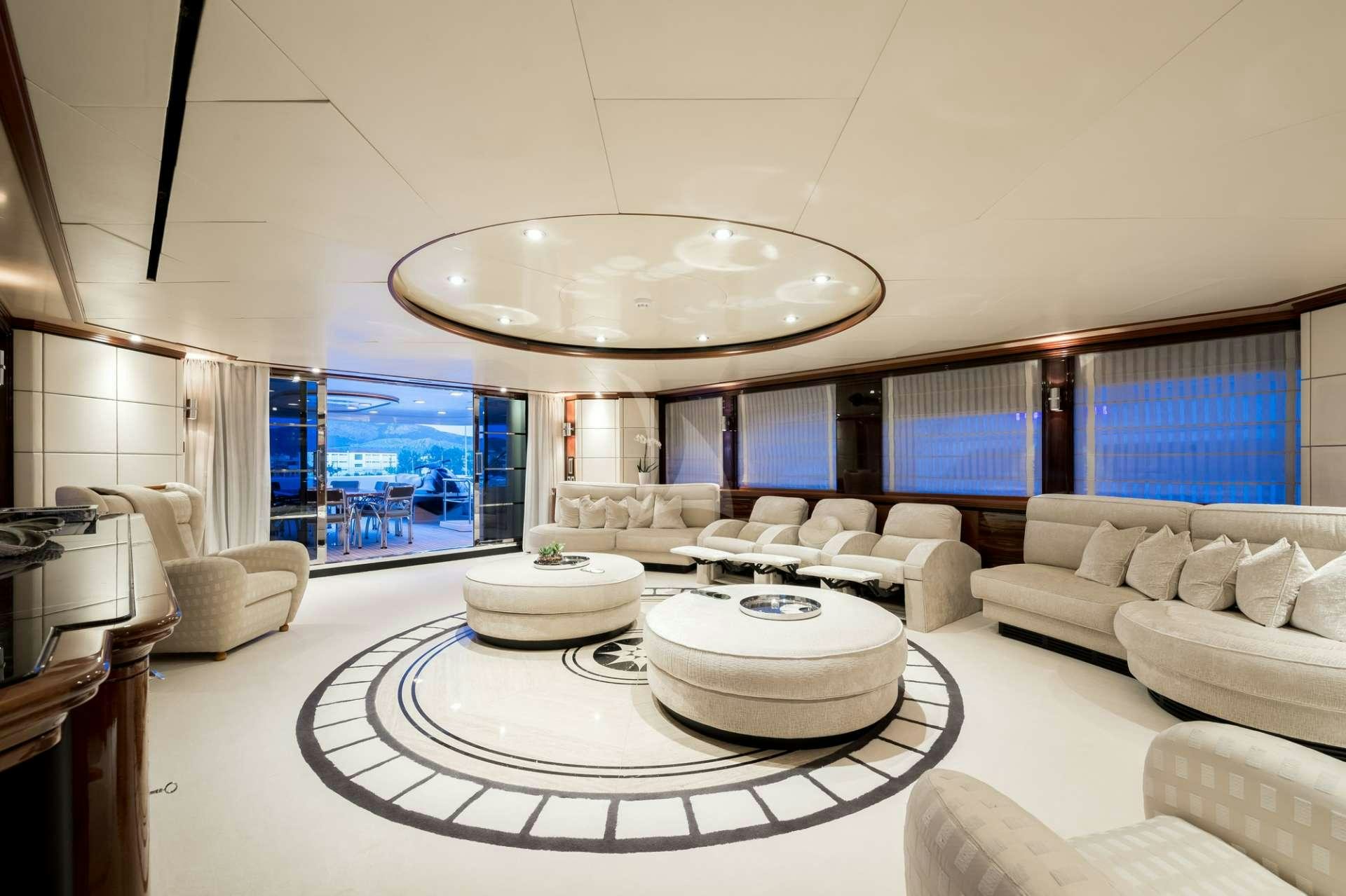 a large white room with a large chandelier aboard MAGENTA M Yacht for Charter