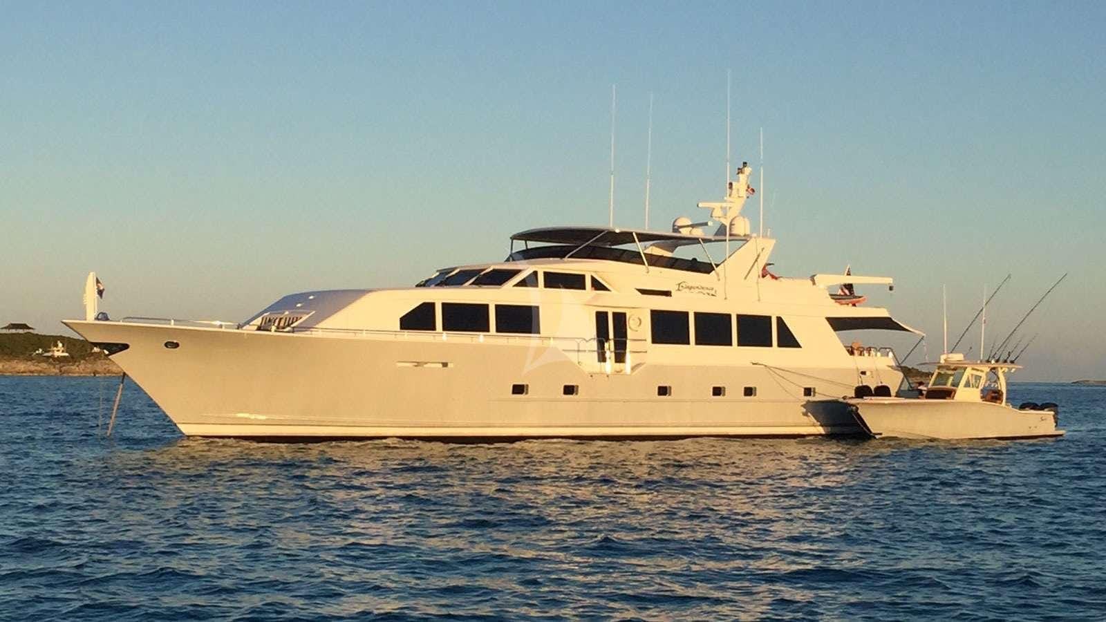 a large white boat in the water aboard XOXO Yacht for Charter