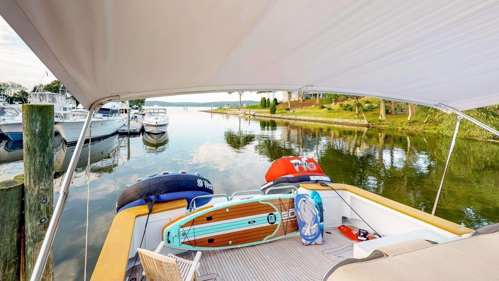 a group of boats on a river aboard XOXO Yacht for Charter