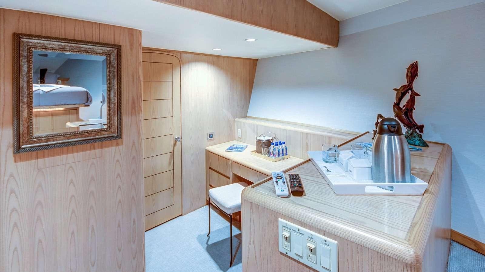 a kitchen with a sink and a mirror aboard XOXO Yacht for Charter