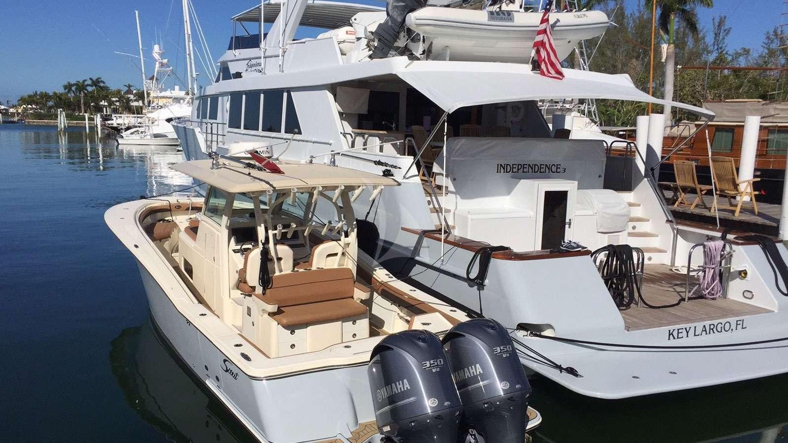 a boat docked at a pier aboard XOXO Yacht for Charter