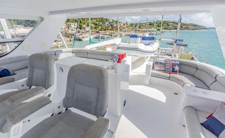 a boat with seats and a seat aboard PRIME TIME Yacht for Charter