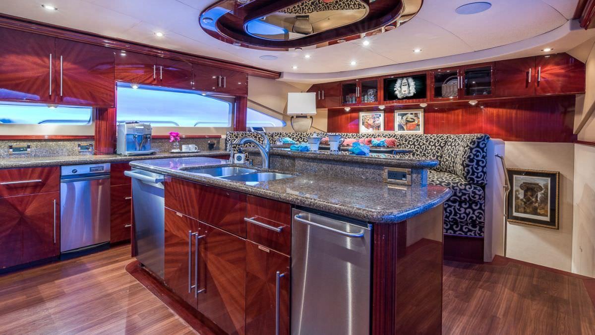 a kitchen with a large island aboard CEDAR ISLAND Yacht for Charter