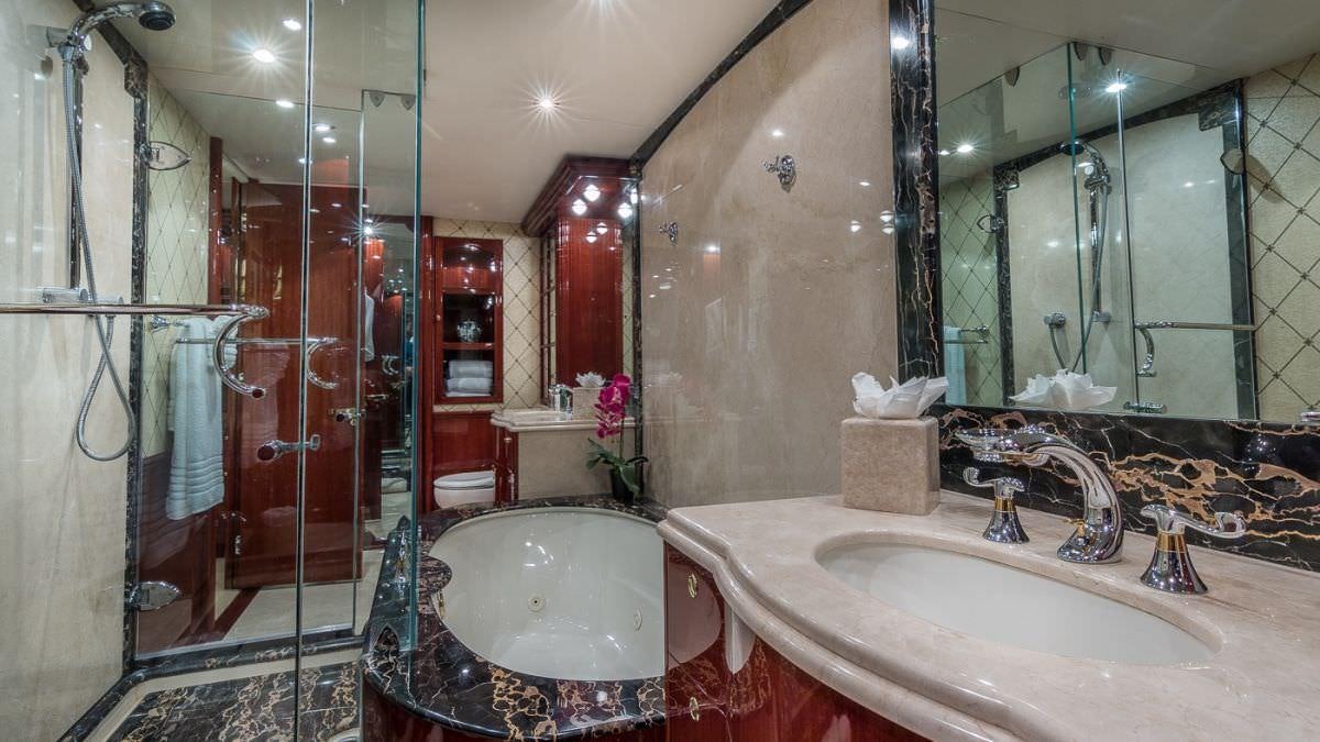 a bathroom with a large tub aboard CEDAR ISLAND Yacht for Charter