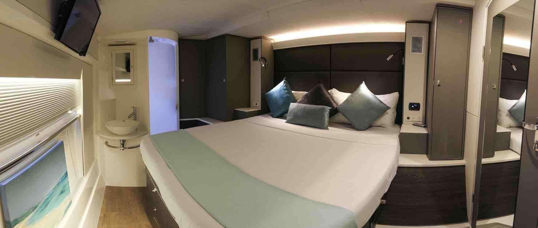 a bed in a room aboard VOYAGE 650 POWER CAT Yacht for Charter