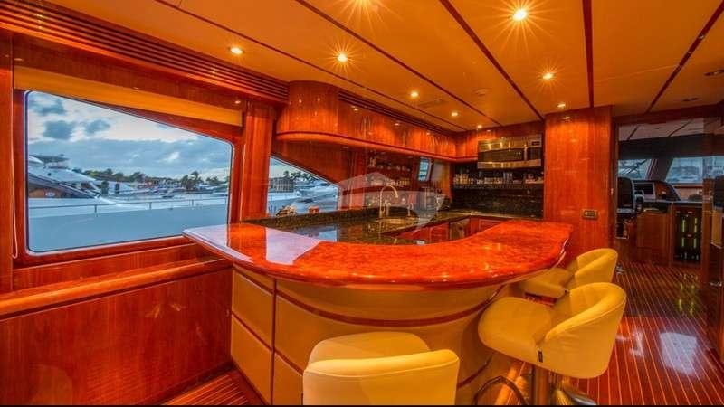 a bar with a table and chairs aboard ANDIAMO Yacht for Charter