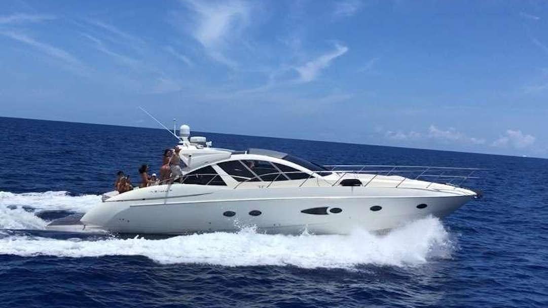 a white yacht in the water aboard SOL Yacht for Charter
