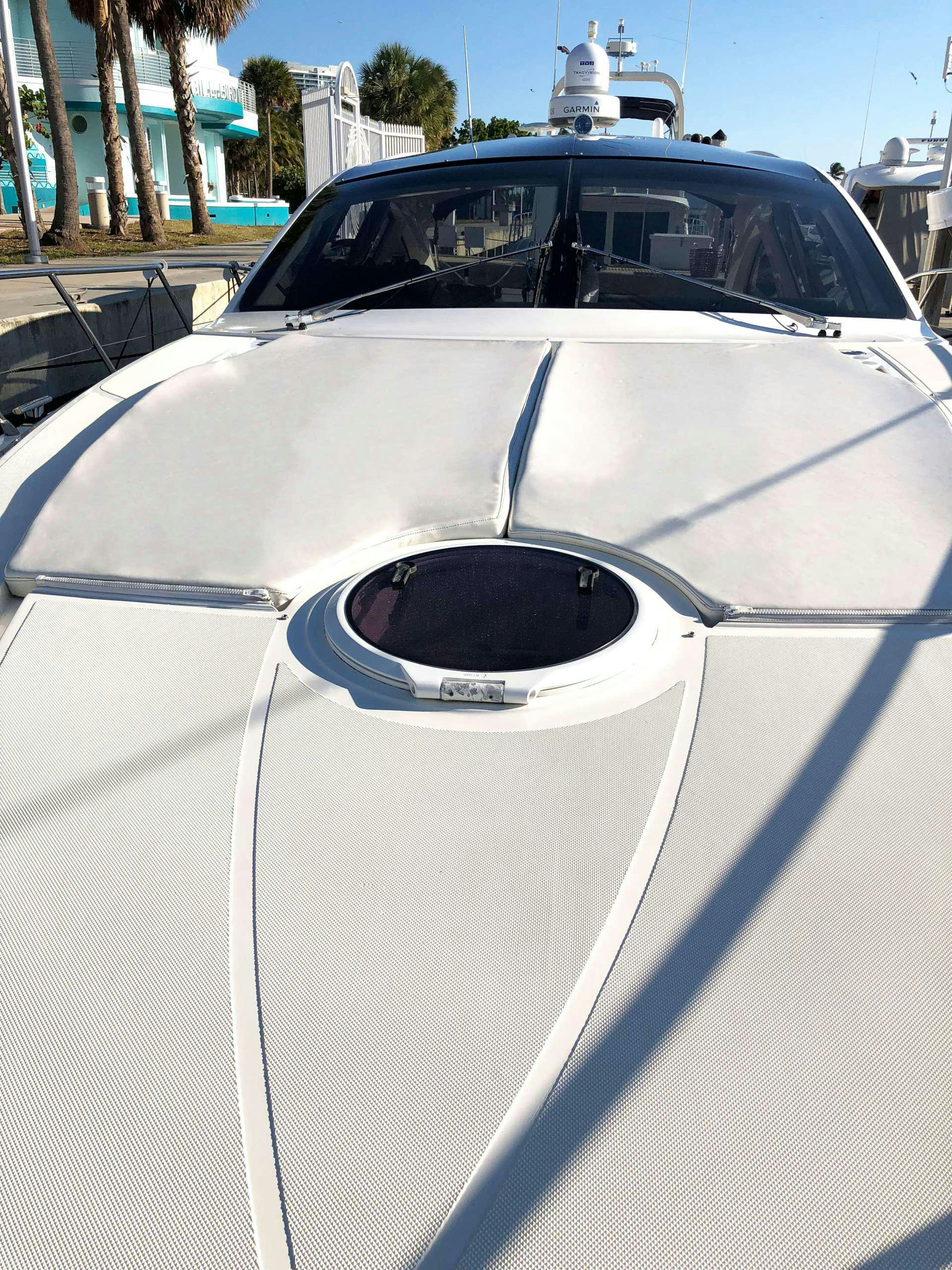 a white car with a white door aboard SOL Yacht for Charter