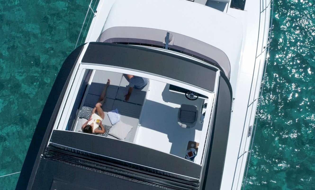 a group of people sitting in a boat on the water aboard Hondo Yacht for Charter