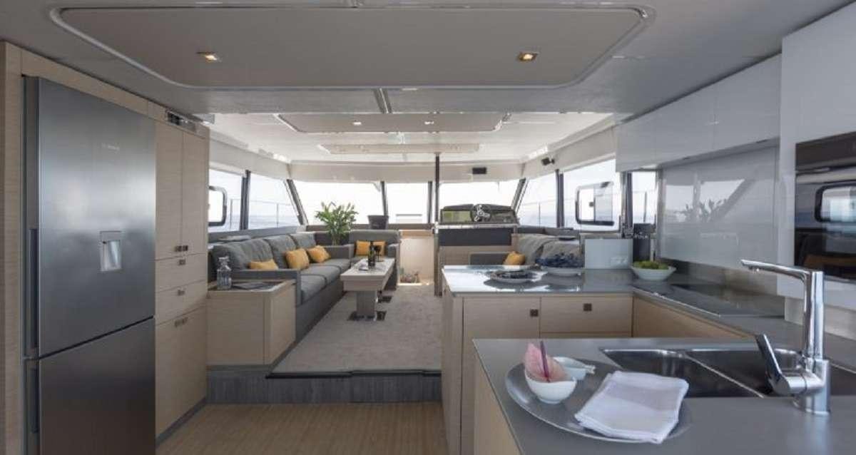 a kitchen with a large island aboard Hondo Yacht for Charter