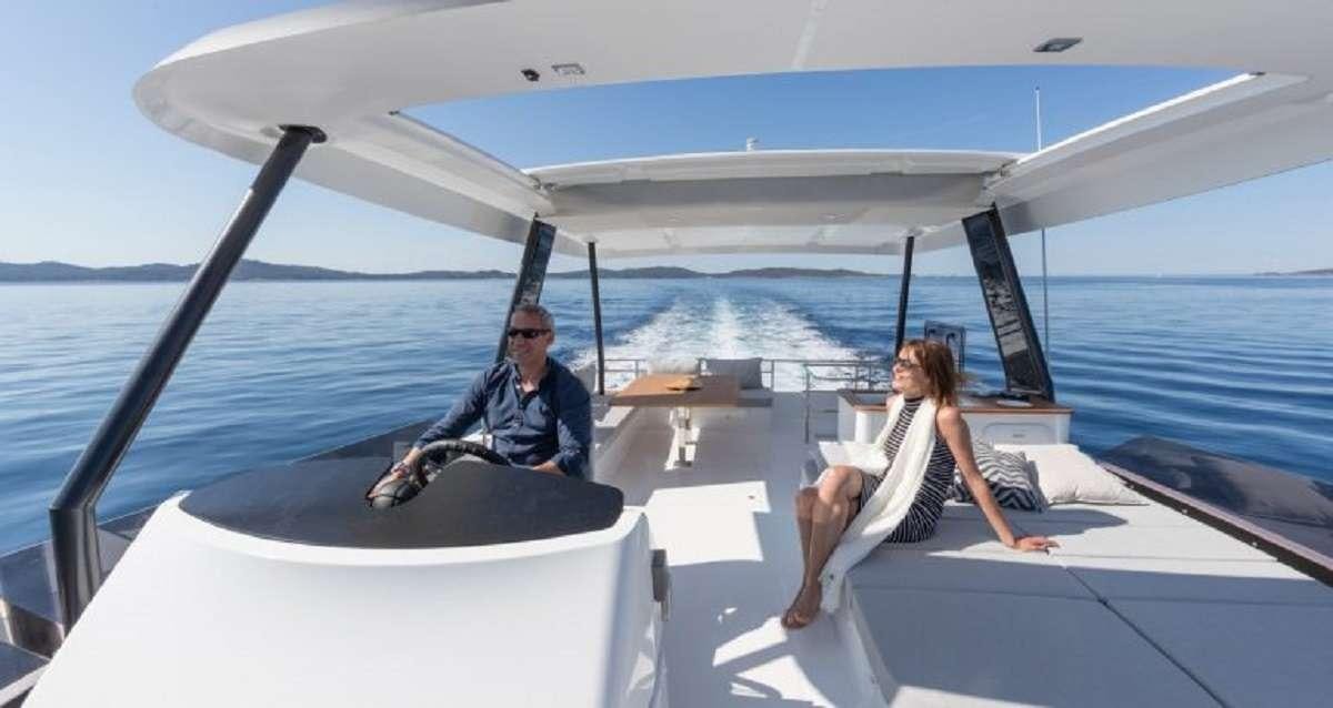 a man and a woman on a boat aboard Hondo Yacht for Charter