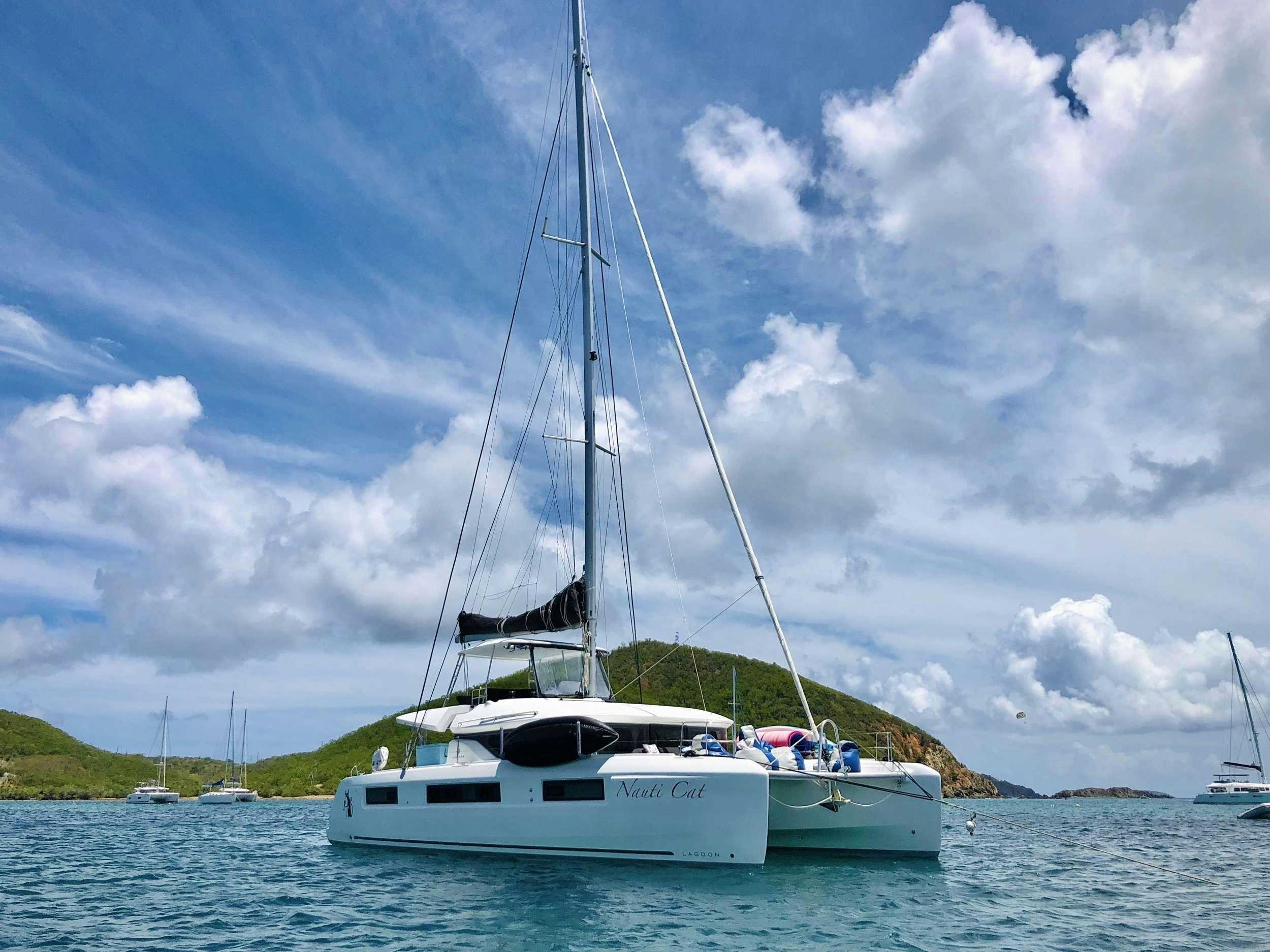 a sailboat on the water aboard NAUTI CAT Yacht for Charter