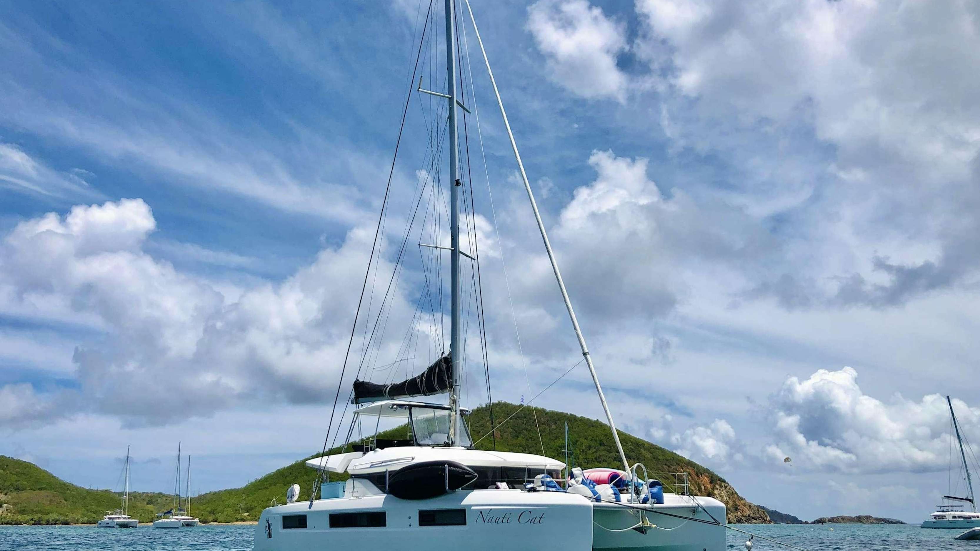 a sailboat on the water aboard NAUTI CAT Yacht for Charter