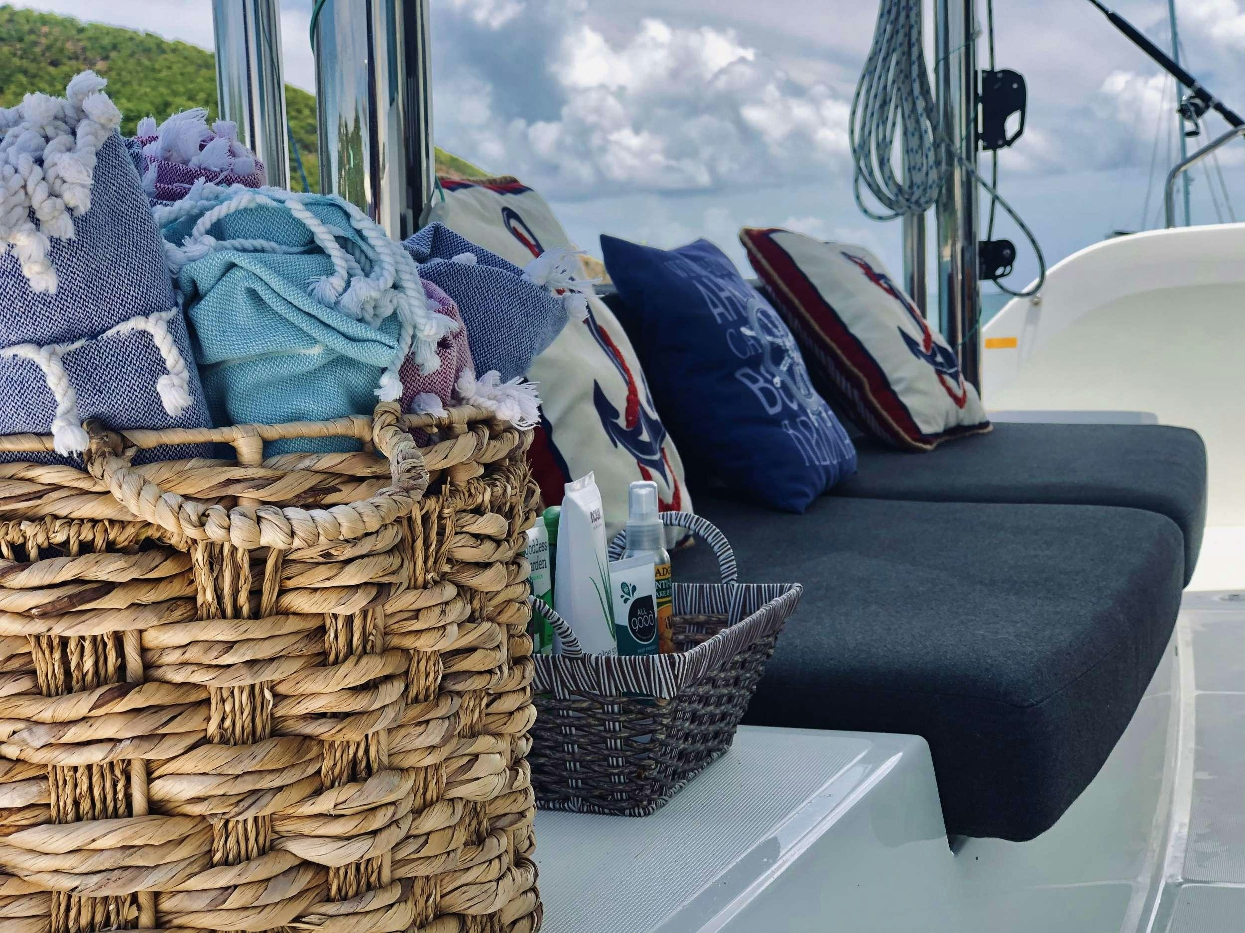 a boat with a basket and a basket on it aboard NAUTI CAT Yacht for Charter