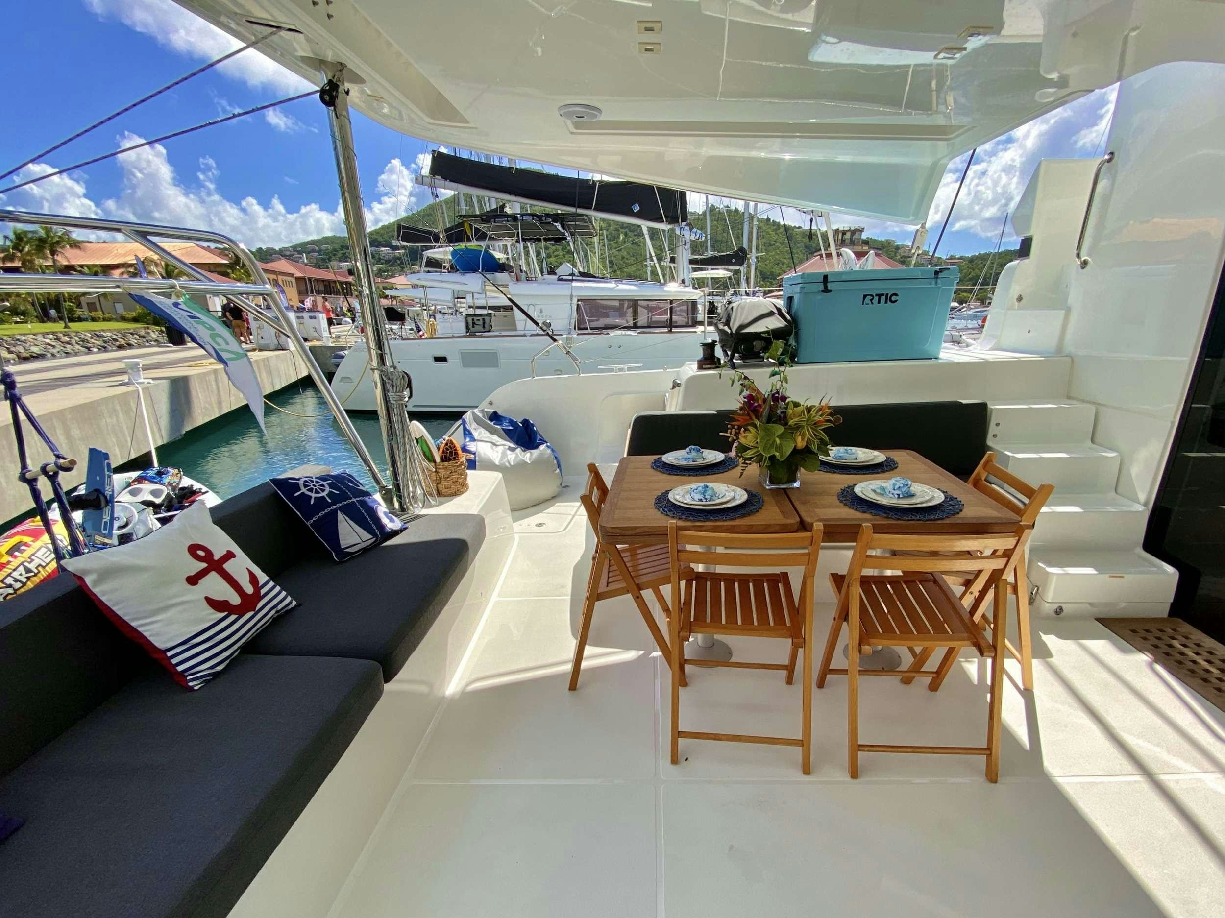 a table on a boat aboard NAUTI CAT Yacht for Charter
