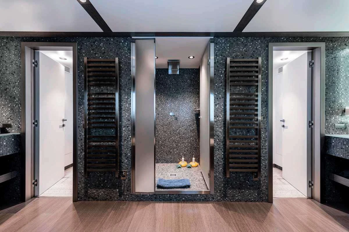 a room with a large glass wall aboard GENESIA Yacht for Charter