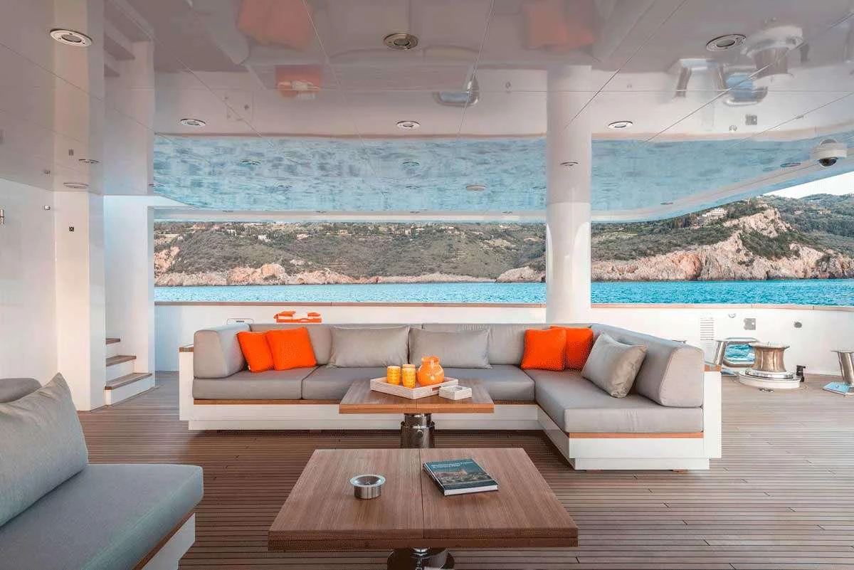 a living room with a large window aboard GENESIA Yacht for Charter
