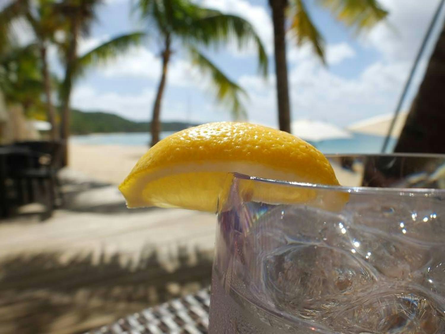 a glass of water on a table aboard HARMONY Yacht for Charter